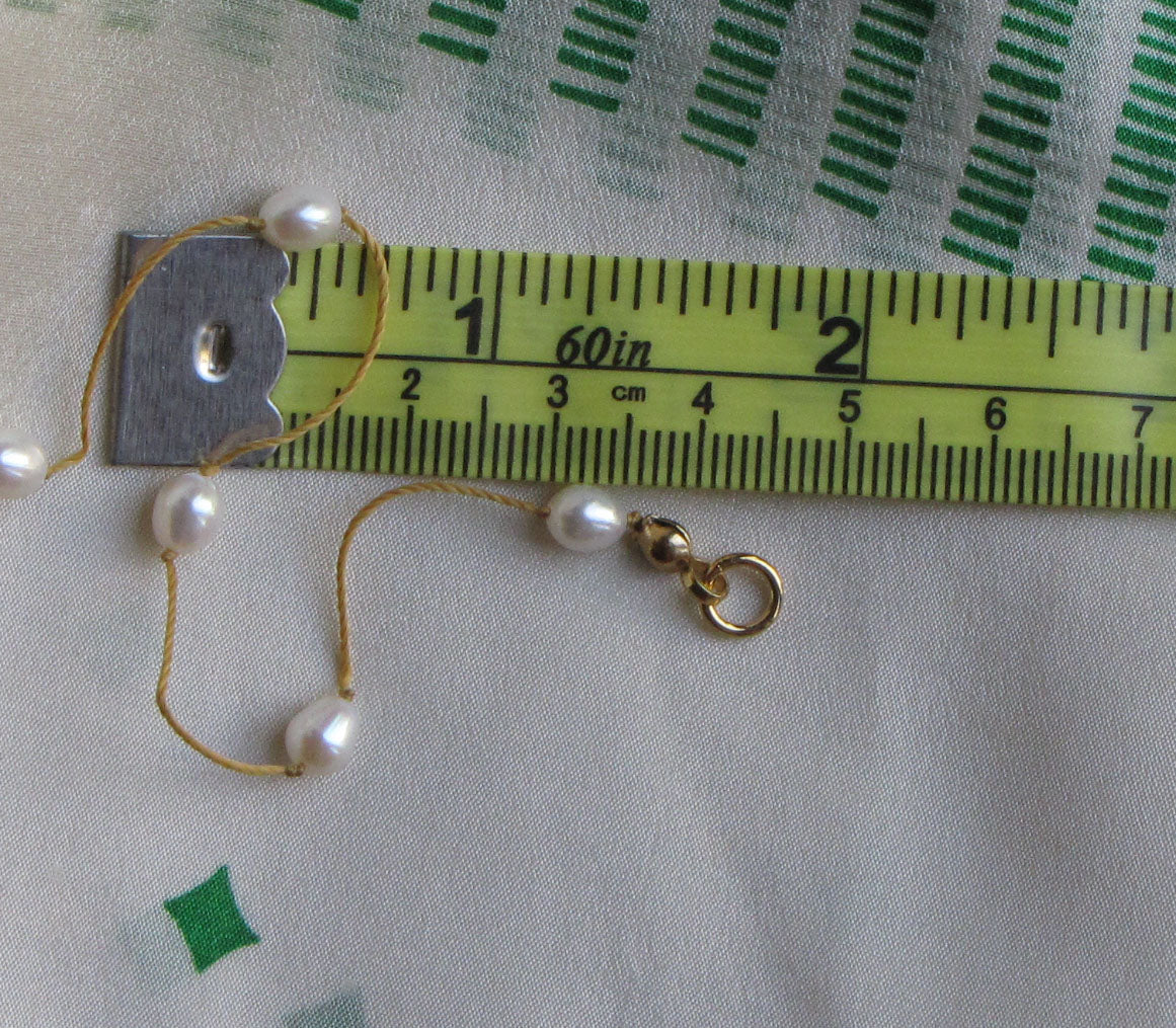 Small, almost oval shaped pearls make for a more fluid look, and measure about 4x3 mm.