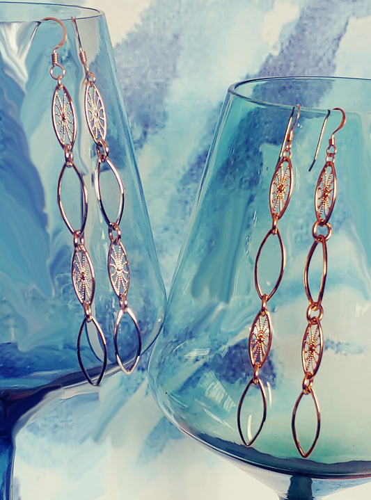 Leaf hoop and sunburst drop earrings in Rhodium and 24k gold plate
