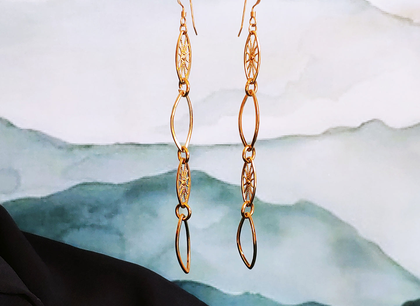 Leaf hoop and sunburst drop earrings in Rhodium and 24k gold plate