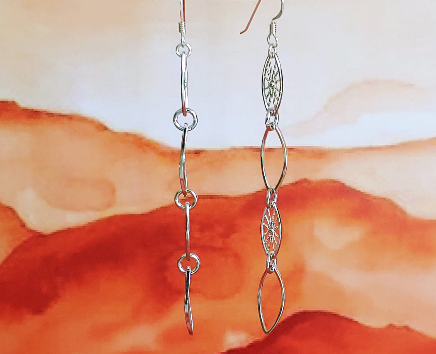 Leaf hoop and sunburst drop earrings in Rhodium and 24k gold plate