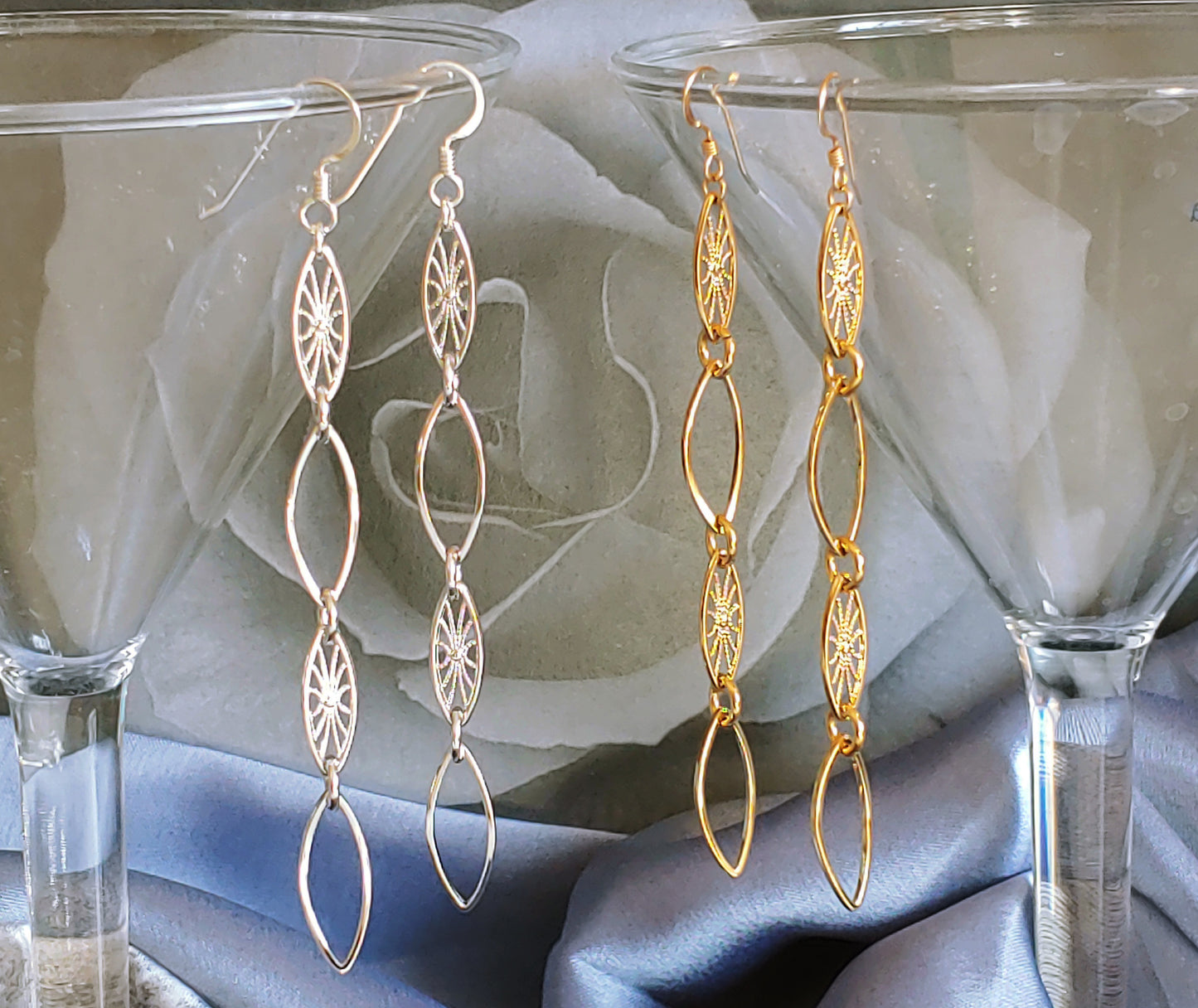 Leaf hoop and sunburst drop earrings in Rhodium and 24k gold plate