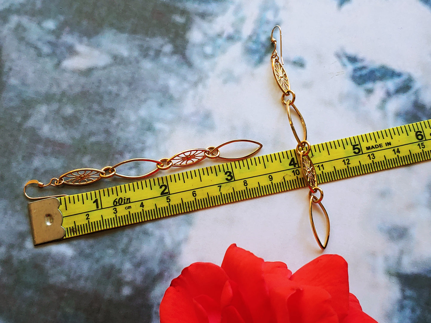 Leaf hoop and sunburst drop earrings in Rhodium and 24k gold plate
