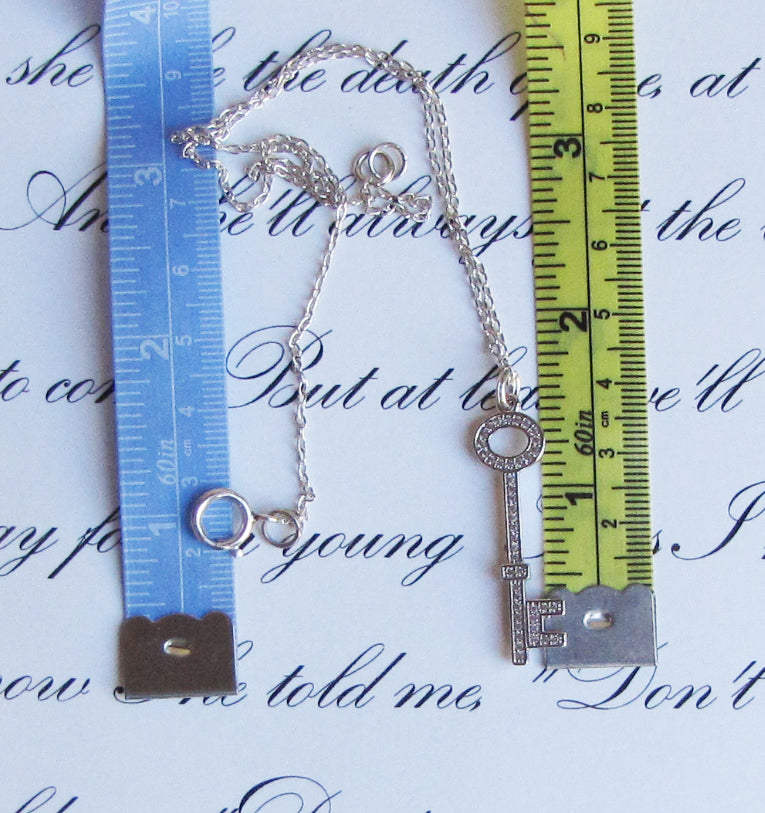 rhodium key pendant with cubic zirconia accents