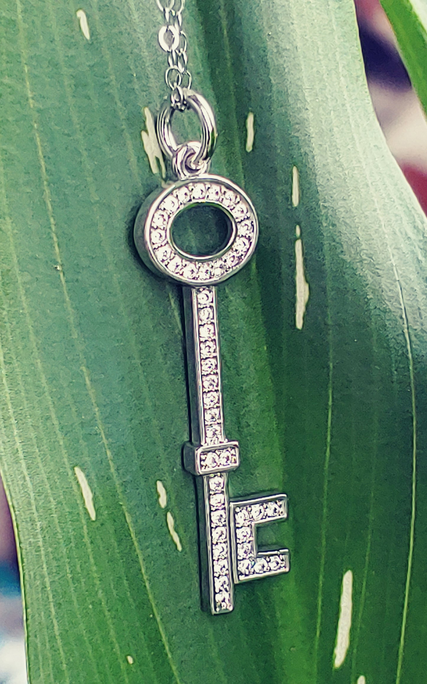 rhodium key pendant with cubic zirconia accents