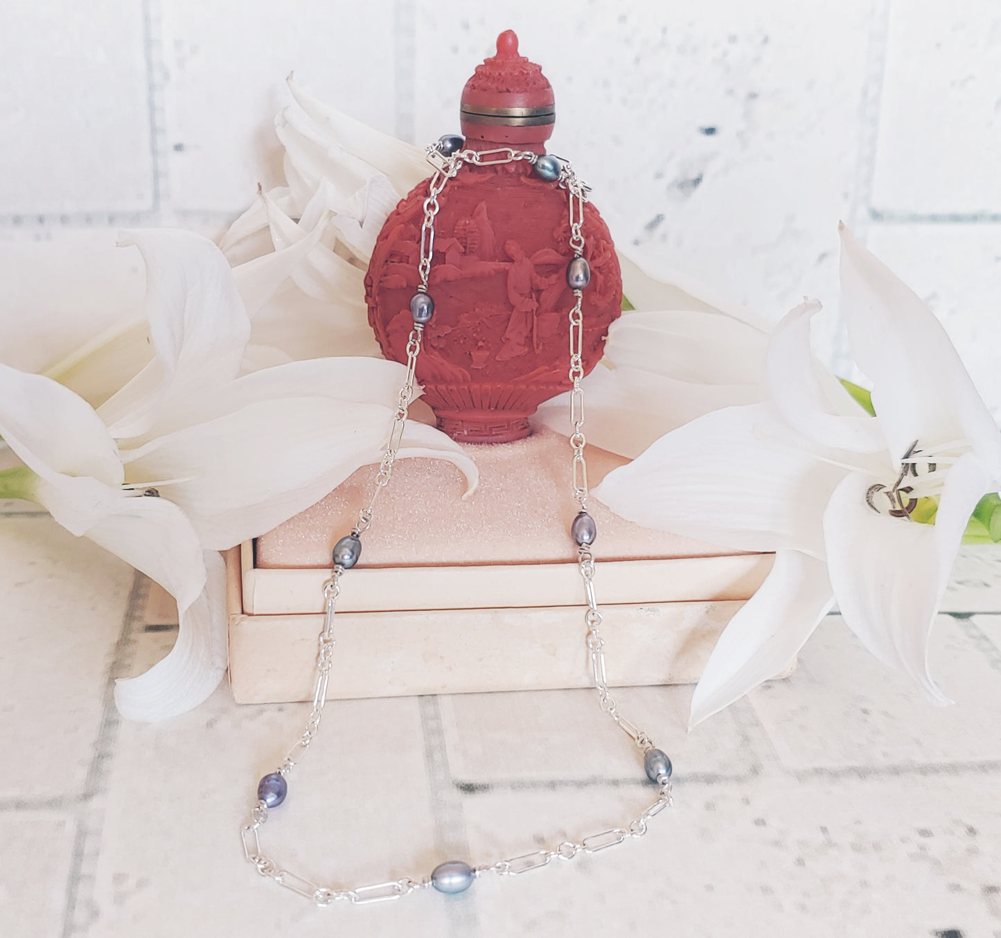 Each pearl is wire wrapped by hand with sterling silver wire.