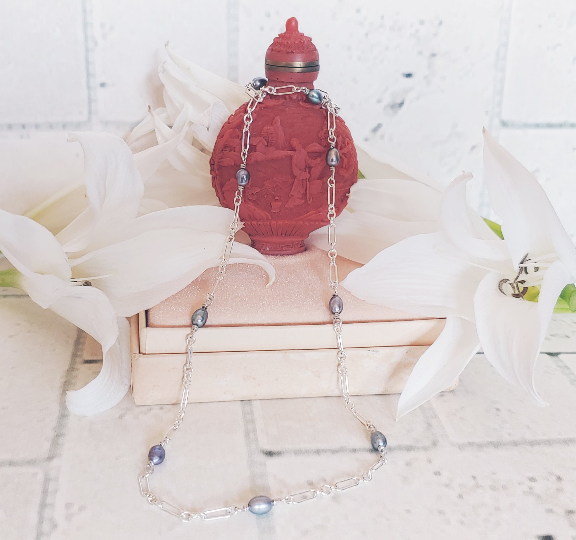 Each pearl is wire wrapped by hand with sterling silver wire.