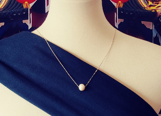 White fresh water pearl floating pendant necklace on sterling silver chain