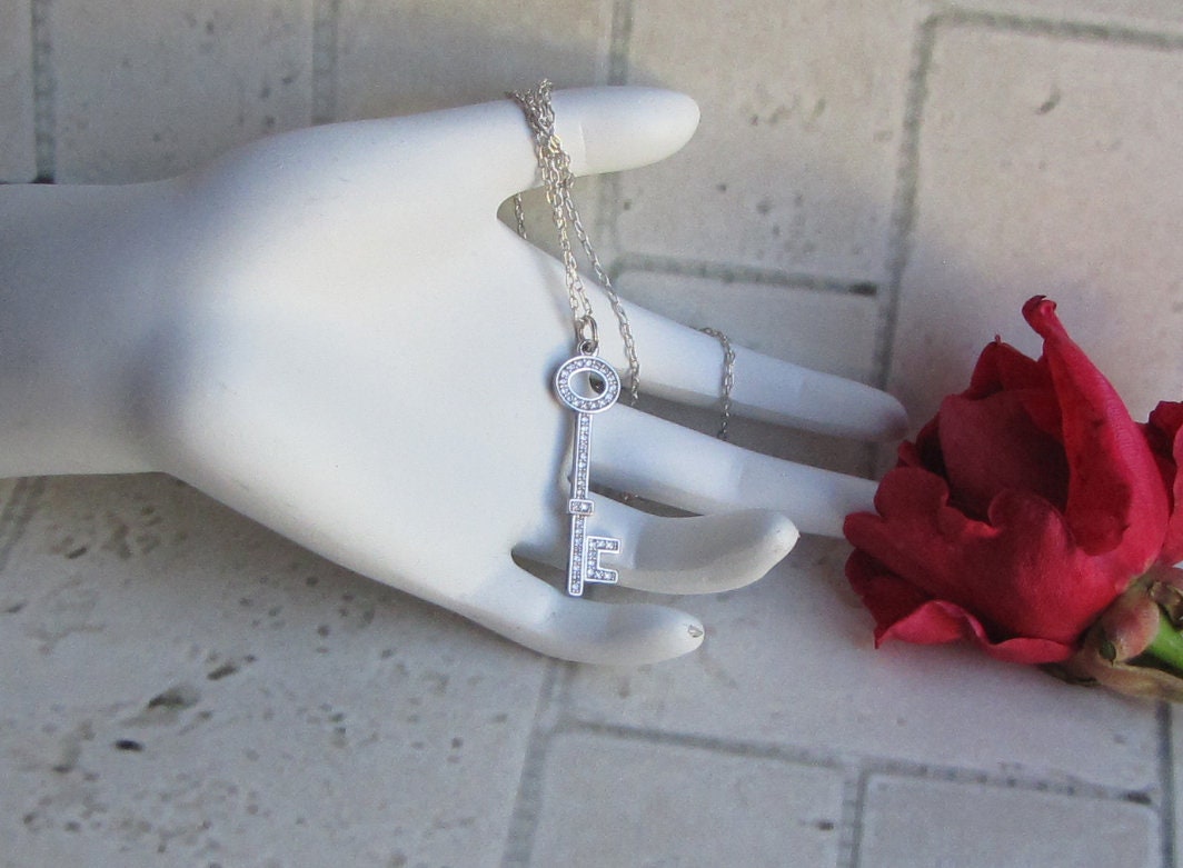 rhodium key pendant with cubic zirconia accents