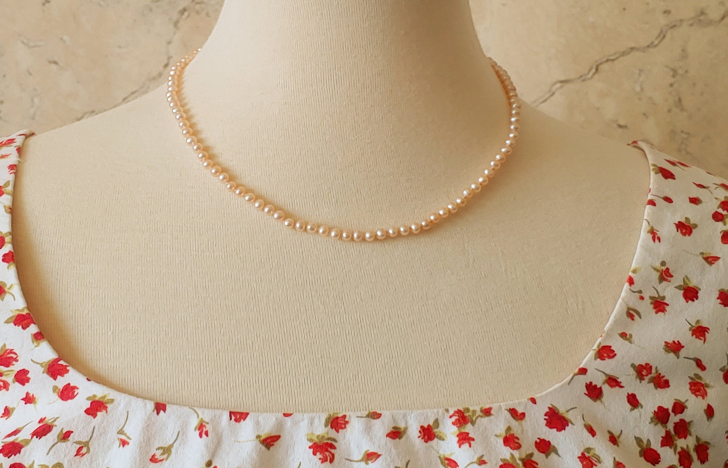 Salmon colored freshwater pearl necklace