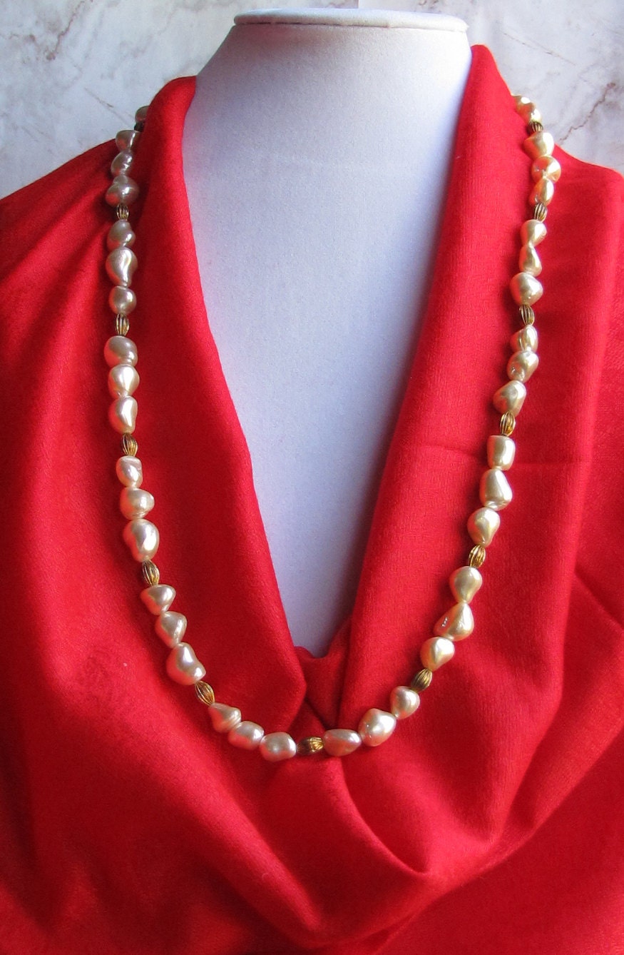 Simulated Baroque pearl necklace with matching earrings.